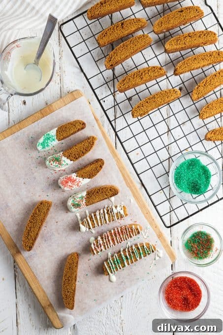 Spiced Gingerbread Biscotti 7 Biscotti cookies with one end dipped in white chocolate and sprinkles