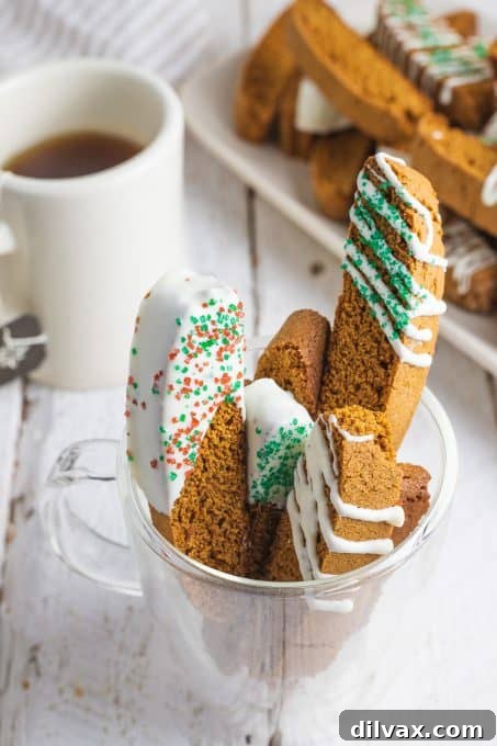 Spiced Gingerbread Biscotti arranged artfully in a mug.