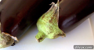 Freshly prepared eggplant slices ready for breading