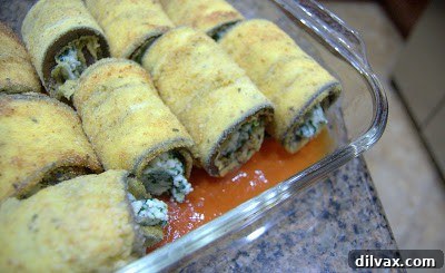 Eggplant rolls arranged in a baking dish