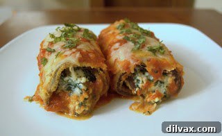 Close-up of a serving of eggplant rollatini with fresh basil