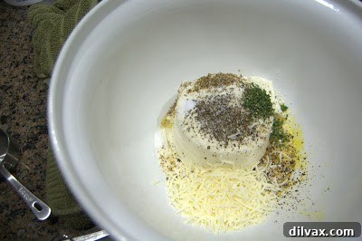 Mixing ricotta cheese and spices for filling