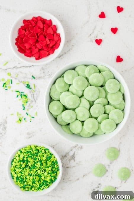 Grinch's Heart-Melting Bark 4 Ingredients for 3 Ingredient Grinch Bark laid out on a surface.