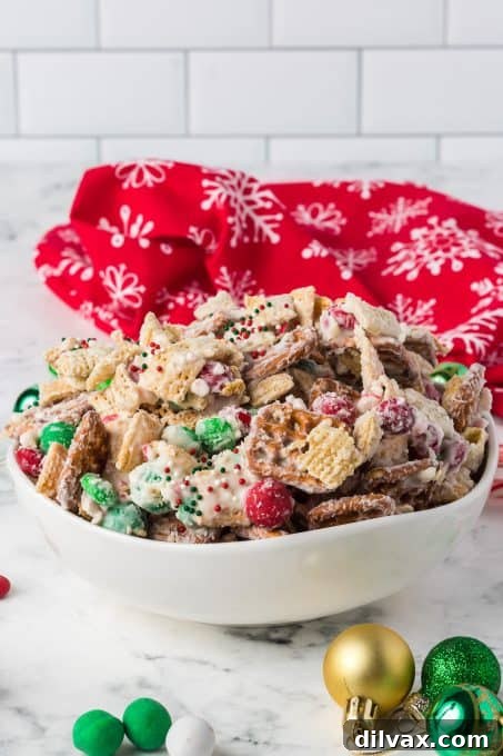 Christmas Snack Mix in a beautiful glass bowl, perfect for holiday gatherings.