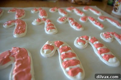 Completed candy cane meringues on baking sheet before baking