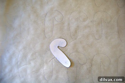Candy cane outlines traced on parchment paper