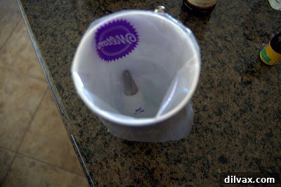 Piping bag in a tall cup for filling