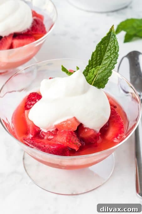 Bowl of macerated strawberries with orange juice and liqueur