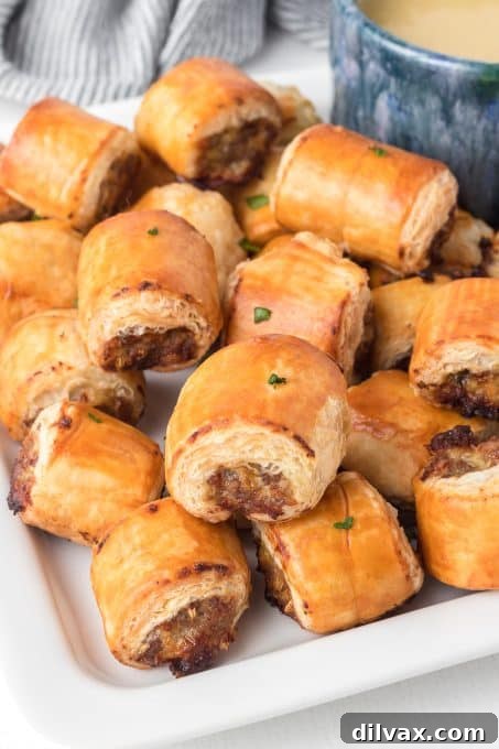 Close-up of savory sausage wrapped in golden puff pastry