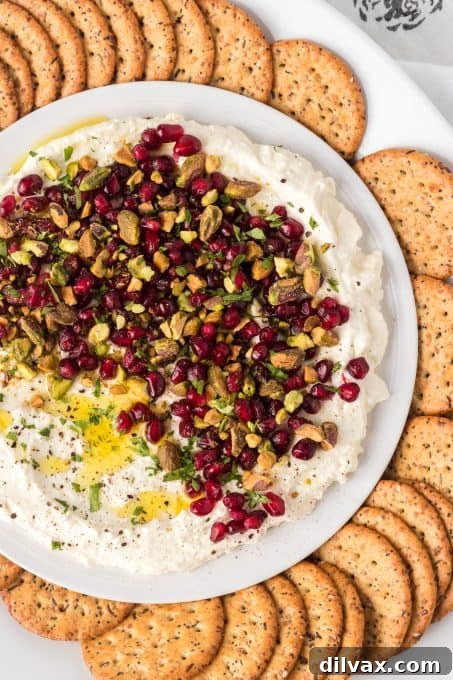 A side view of a creamy whipped feta dip, showcasing its smooth texture and rich appearance.