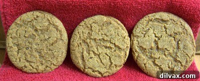 A close-up of beautifully golden-brown Ginger Chewies with intricate crackle patterns on a plate
