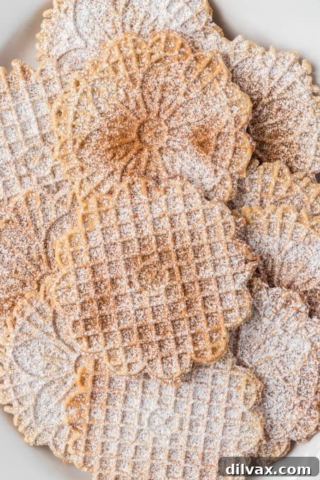 A stack of golden Chai Pizzelles, artfully presented.