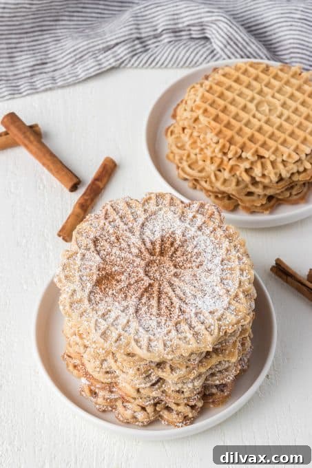A stack of classic Italian Pizzelles infused with aromatic chai spices.