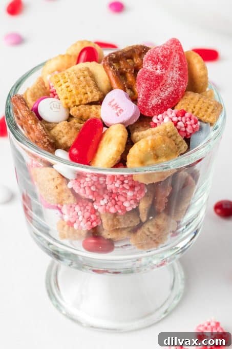 Cupid's Crunch Mix 3 Close-up of Valentine Snack Mix showing a blend of cereals, pretzels, and heart-shaped candies.