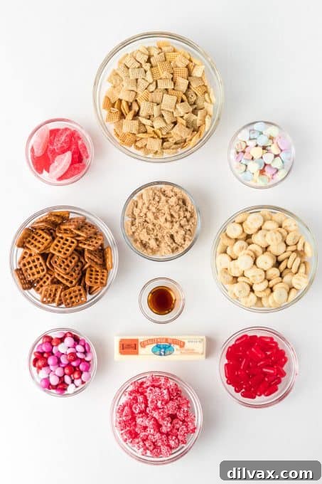 Cupid's Crunch Mix 4 A selection of ingredients laid out, including Chex cereal, pretzels, oyster crackers, and various Valentine-themed candies.