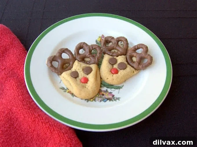 Peanut Butter cookies with chocolate covered pretzels, cinnamon red hots and chocolate chips make these fun holiday cookies!