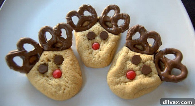 Peanut Butter cookies with chocolate covered pretzels, cinnamon red hots and chocolate chips make these fun holiday cookies!