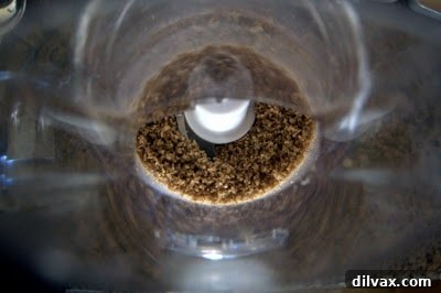Finely ground pecans in a food processor