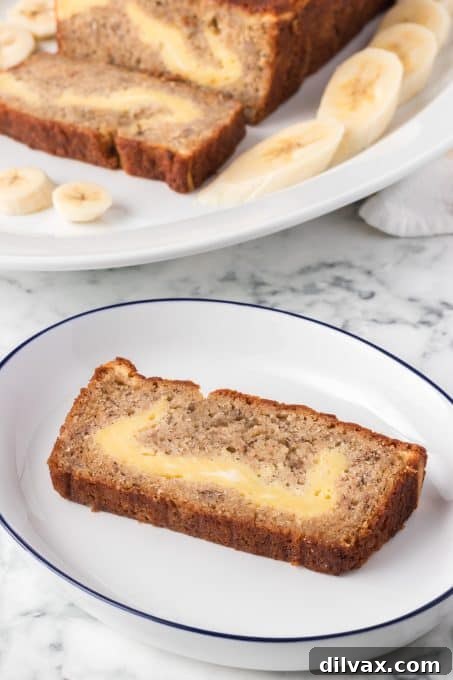A banana quick bread with a cream cheese swirl.