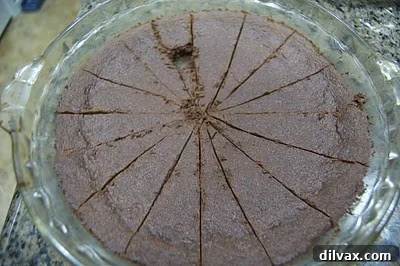 Chocolate Peppermint Shortbread Day 2 of 12 Festive Cookies 10 Baked shortbread in a pie plate, with one wedge removed for tasting