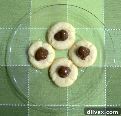 Finished chocolate covered cherry thumbprint cookies, ready to be served