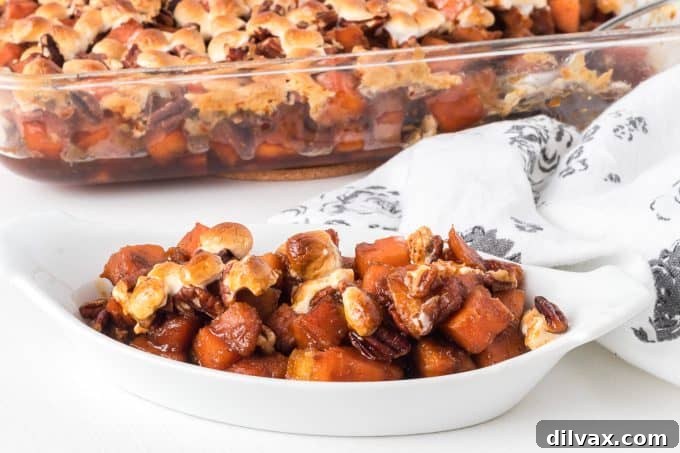 Molasses Glazed Sweet Potatoes with a toasted pecan marshmallow topping.