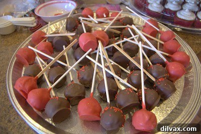A Two Day Baking Bonanza 22 Beautifully decorated cake pops, neatly arranged and ready for transport.
