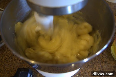 A Two Day Baking Bonanza 8 Pâte à choux dough in a mixing bowl with a paddle attachment, during the egg incorporation stage.