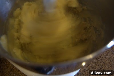 A Two Day Baking Bonanza 9 Close-up of the dough in the mixer, showing a smooth, glossy texture as eggs are absorbed.
