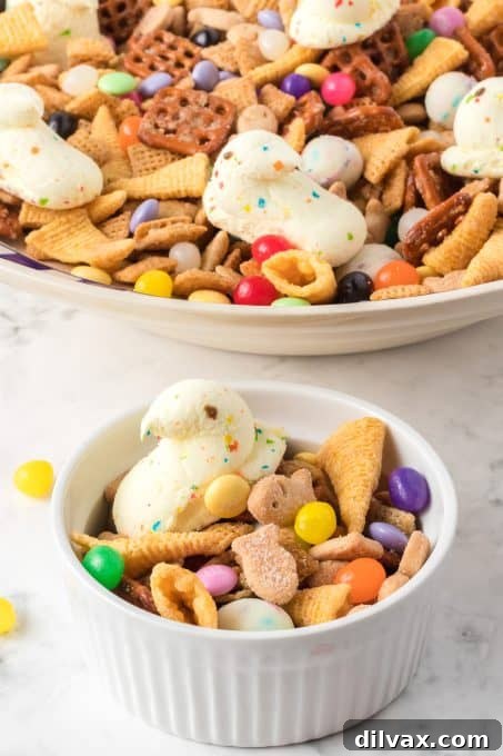 A festive and colorful sweet and salty snack mix, perfectly arranged in a bowl for an Easter celebration.