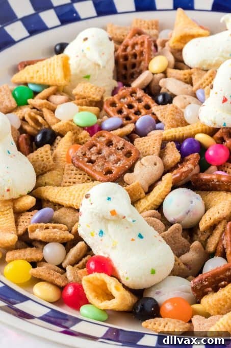 A beautifully presented bowl of Easter Snack Mix, featuring a variety of textures and colors, perfect for a gathering.
