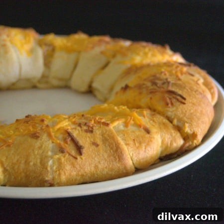 Budget-Friendly Barbecue Chicken Salad Crescent Ring 12 Barbecue chicken salad sprinkled with cheese, wrapped in crescent rolls for a fun dinner!
