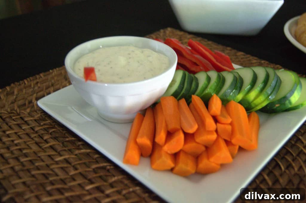 Budget-Friendly Barbecue Chicken Salad Crescent Ring 14 Platter of fresh sliced cucumbers, red bell peppers, and carrots served with dipping sauce