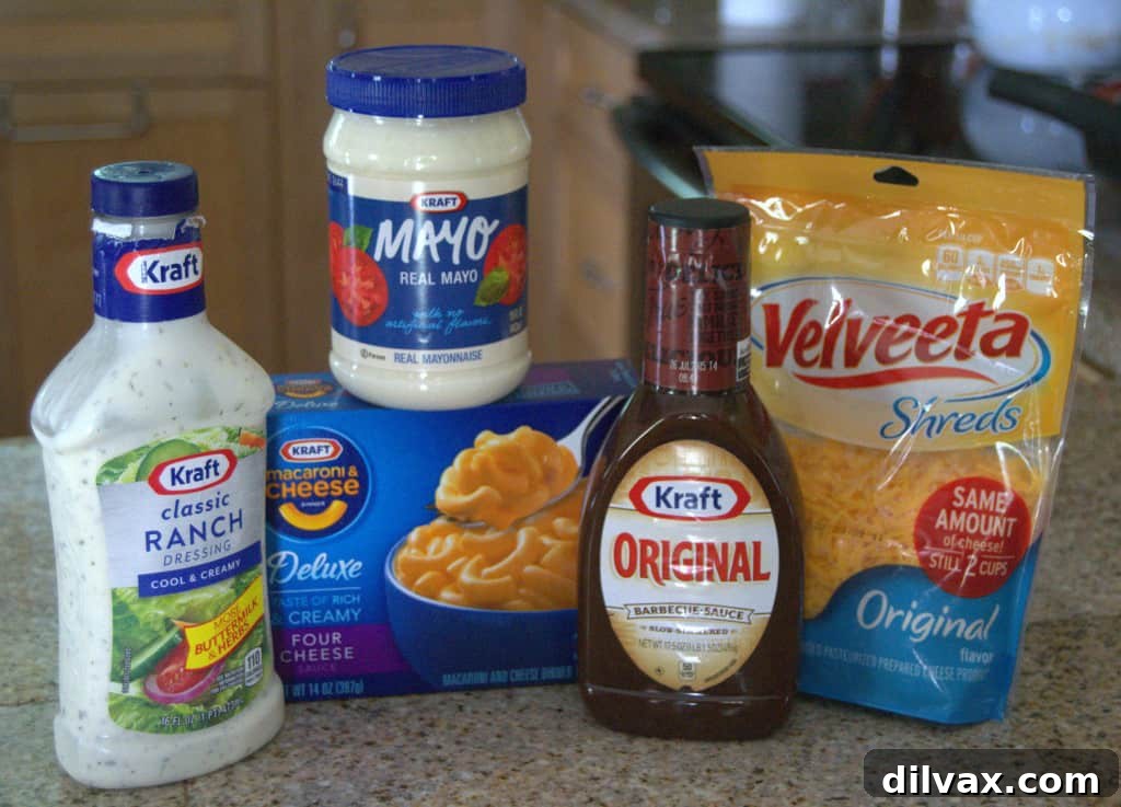 Budget-Friendly Barbecue Chicken Salad Crescent Ring 5 A complete dinner spread featuring Barbecue Chicken Salad Crescent Ring, Mac & Cheese with broccoli, and fresh vegetables