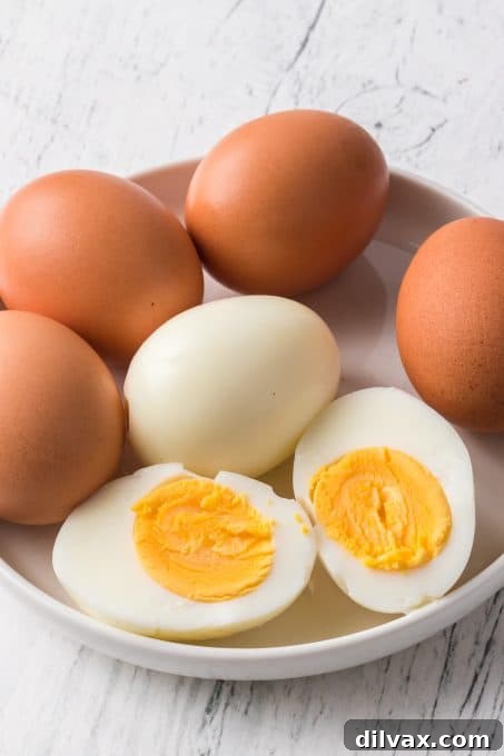 Perfectly cooked eggs from an air fryer, ready for peeling or storage.