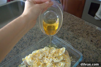 Harvest Apple and Cheesy Chicken Bake 7 Apple juice carefully poured into the baking dish around the chicken, adding moisture and flavor