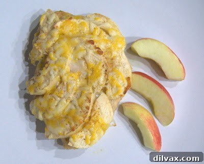 Harvest Apple and Cheesy Chicken Bake 9 The Apple Cheese Chicken baking beautifully in the oven, cheese bubbling and turning golden