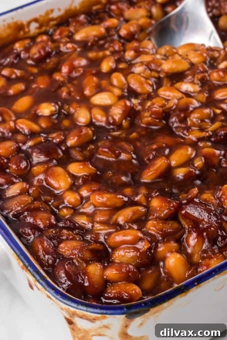 Sweet & Savory Bean Bake 3 A close-up of a serving of homemade baked beans, showcasing the rich, thick sauce and tender beans.