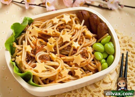 More Than 25 Creative Back to School Lunch Ideas 25 A creative bento box featuring spaghetti arranged to look like stars, adding a playful touch to mealtime.