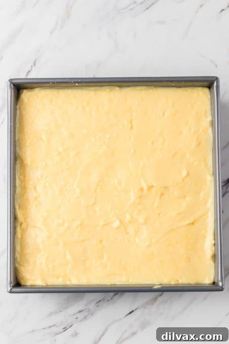 Pina Colada Bliss Bars 6 The pudding layer of a coconut pineapple dream bar.