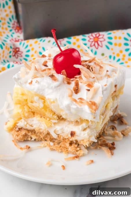 Pina Colada Bliss Bars 7 A no bake bar with coconut and pineapple layers.