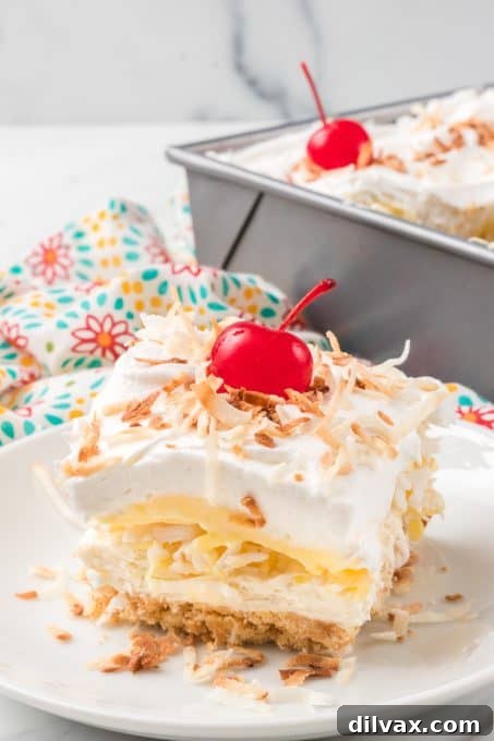 Pina Colada Bliss Bars 10 A no bake layered cheesecake dessert with coconut and pineapple.
