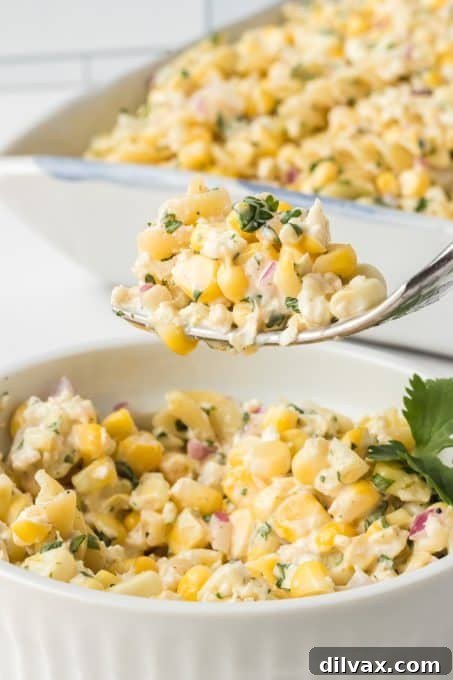 A close-up bite of an easy corn pasta salad, highlighting its texture and freshness