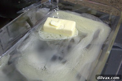 Melted butter evenly spread in a 9x13 inch baking dish.