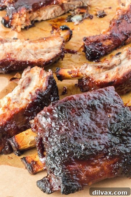 The final presentation of a full rack of oven-baked barbecued ribs, perfectly glazed and ready.