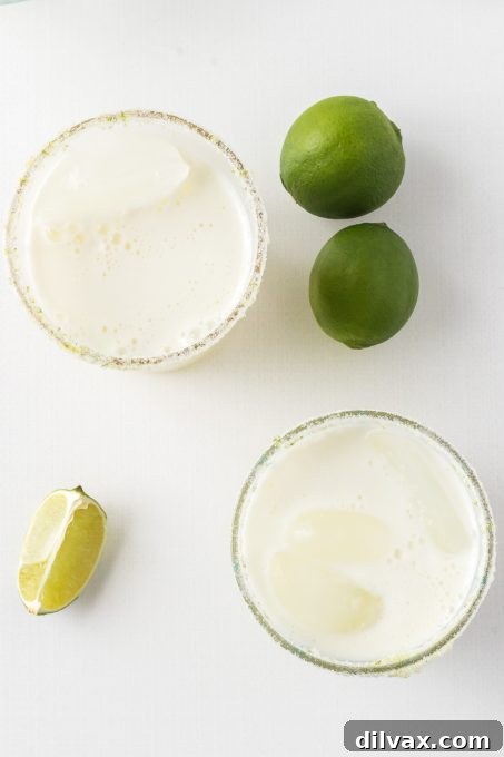 Velvet Lemonade 9 A refreshing limeade - A close-up of the drink with condensation on the glass.