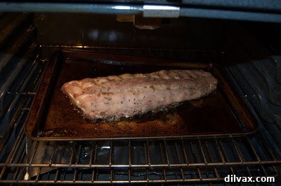 Sweet and Tangy Honey Mustard Ribs 6 Honey-glazed ribs baking uncovered in the oven at a higher temperature.