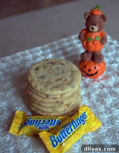 A stack of freshly baked Egg Yolk Butterfinger Cookies on a cooling rack.