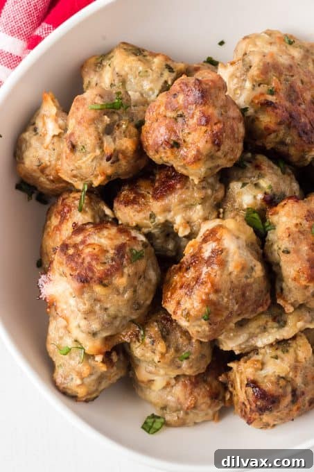 Savory Handcrafted Meatballs 11 A close-up view of meatballs, showcasing the perfect blend of ground pork, beef, and veal.