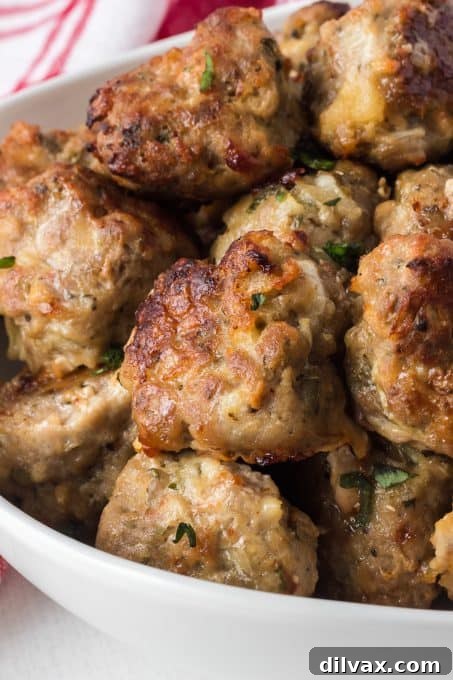 Savory Handcrafted Meatballs 12 A serving of meatballs made with a combination of ground beef, pork, and veal, ideal for various pasta dishes and meatball subs.